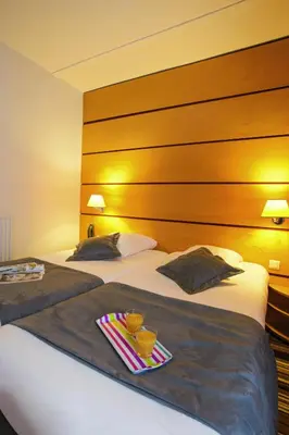 Un ou plusieurs lits dans un hébergement de l'établissement Belambra Clubs & Hotels - Le Magendie