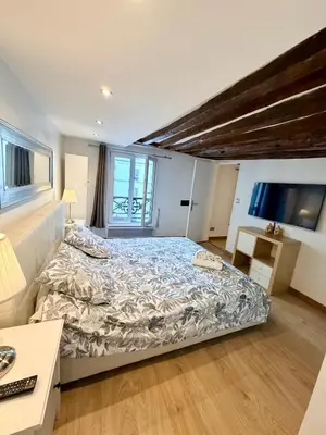 Un ou plusieurs lits dans un hébergement de l'établissement Superbe Appartement