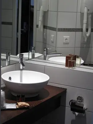 Salle de bains dans l'établissement Source Hôtel