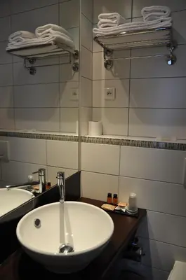 Salle de bains dans l'établissement Source Hôtel