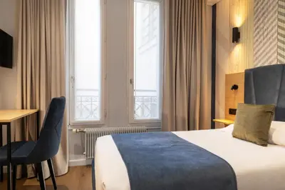 Un ou plusieurs lits dans un hébergement de l'établissement Hotel Espace Champerret