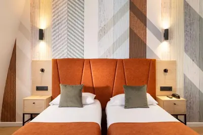 Un ou plusieurs lits dans un hébergement de l'établissement Hotel Espace Champerret
