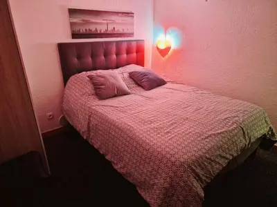 Un ou plusieurs lits dans un hébergement de l'établissement Appartement au coeur du Paris.