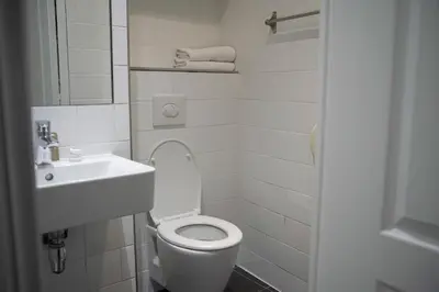Salle de bains dans l'établissement Sully Hôtel