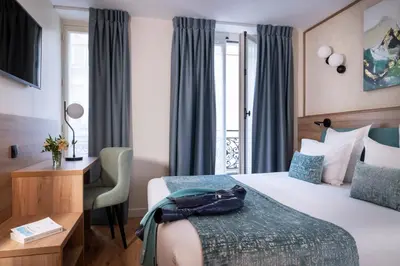 Un ou plusieurs lits dans un hébergement de l'établissement Hôtel Théorème