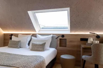 Un ou plusieurs lits dans un hébergement de l'établissement Hôtel Théorème