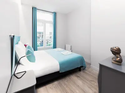 Un ou plusieurs lits dans un hébergement de l'établissement Chic Apartments Opera