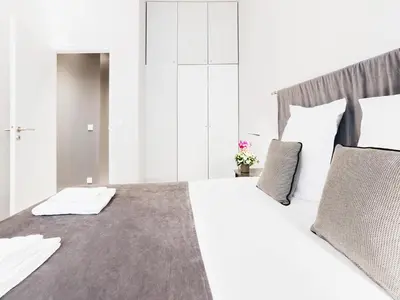 Un ou plusieurs lits dans un hébergement de l'établissement Chic Apartments Opera