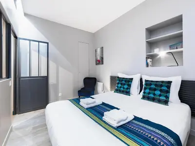 Un ou plusieurs lits dans un hébergement de l'établissement Chic Apartments Opera
