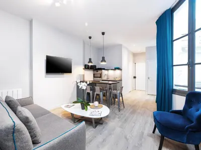 Télévision ou salle de divertissement dans l'établissement Chic Apartments Opera