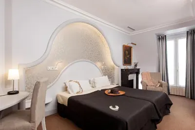 Un ou plusieurs lits dans un hébergement de l'établissement Hotel Bonaparte