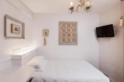 Un ou plusieurs lits dans un hébergement de l'établissement Hotel Bonaparte