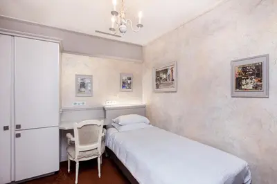 Un ou plusieurs lits dans un hébergement de l'établissement Hotel Bonaparte