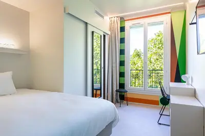 Un ou plusieurs lits dans un hébergement de l'établissement Graphik Montparnasse