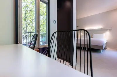 Un ou plusieurs lits dans un hébergement de l'établissement Graphik Montparnasse