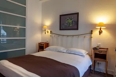 Un ou plusieurs lits dans un hébergement de l'établissement Hôtel Atlantis