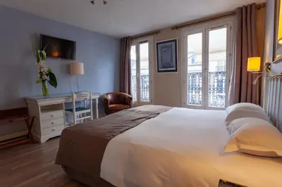 Un ou plusieurs lits dans un hébergement de l'établissement Hôtel Atlantis