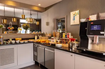 Cuisine ou kitchenette dans l'établissement Hotel Muguet