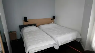 Un ou plusieurs lits dans un hébergement de l'établissement Hotel Rivoli