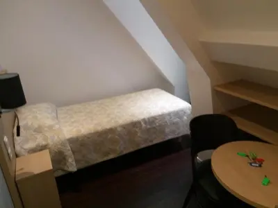 Un ou plusieurs lits dans un hébergement de l'établissement Hotel Rivoli