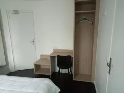 Un ou plusieurs lits dans un hébergement de l'établissement Hotel Rivoli