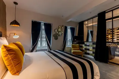 Un ou plusieurs lits dans un hébergement de l'établissement BE YOU LUXURY APART'HÔTEL Paris