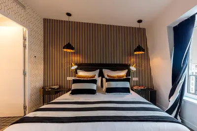 Un ou plusieurs lits dans un hébergement de l'établissement BE YOU LUXURY APART'HÔTEL Paris