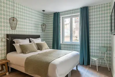 Un ou plusieurs lits dans un hébergement de l'établissement BE YOU LUXURY APART'HÔTEL Paris