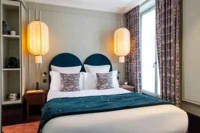 Un ou plusieurs lits dans un hébergement de l'établissement Hôtel Monte Cristo