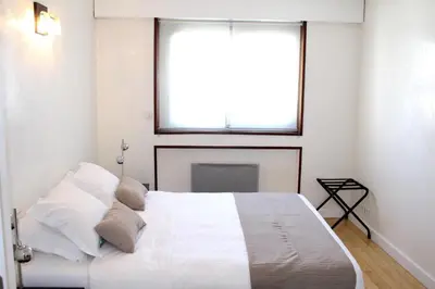 Un ou plusieurs lits dans un hébergement de l'établissement Short Stay Paris Apartments