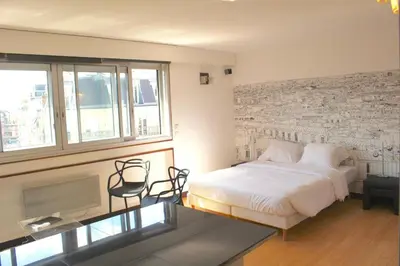 Un ou plusieurs lits dans un hébergement de l'établissement Short Stay Paris Apartments