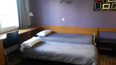 Un ou plusieurs lits dans un hébergement de l'établissement Aparthotel Paris 15 Porte de Versailles