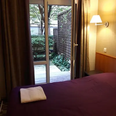 Un ou plusieurs lits dans un hébergement de l'établissement Aparthotel Paris 15 Porte de Versailles