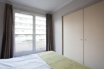 Un ou plusieurs lits dans un hébergement de l'établissement Aparthotel Paris 15 Porte de Versailles