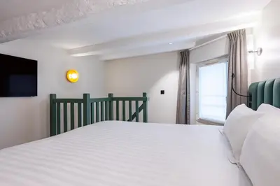 Un ou plusieurs lits dans un hébergement de l'établissement Hotel Elysée Secret