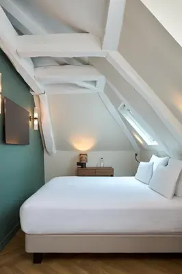 Un ou plusieurs lits dans un hébergement de l'établissement Hotel Elysée Secret