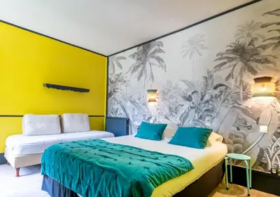 Un ou plusieurs lits dans un hébergement de l'établissement Nouvel Hôtel