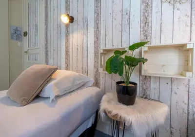 Un ou plusieurs lits dans un hébergement de l'établissement Nouvel Hôtel