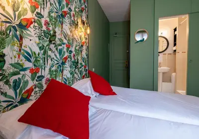 Un ou plusieurs lits dans un hébergement de l'établissement Nouvel Hôtel