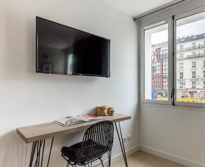 Télévision ou salle de divertissement dans l'établissement Résidence Palais Étoile