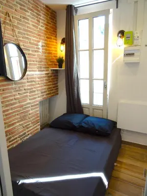 Un ou plusieurs lits dans un hébergement de l'établissement ★★★Studio Heart of Le Marais, Design Flat★★★