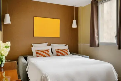 Un ou plusieurs lits dans un hébergement de l'établissement Edgar Suites Expo Paris Porte de Versailles