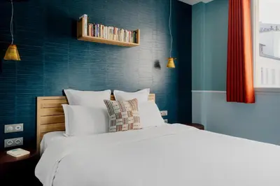 Un ou plusieurs lits dans un hébergement de l'établissement Edgar Suites Expo Paris Porte de Versailles