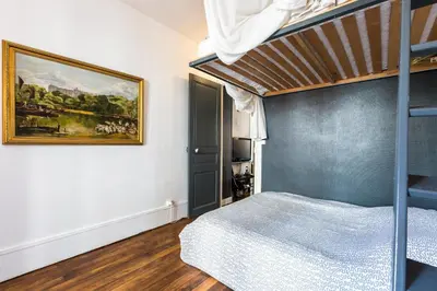 Un ou plusieurs lits dans un hébergement de l'établissement Cosy 40m² near MONTMARTRE