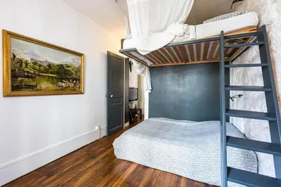 Un ou plusieurs lits dans un hébergement de l'établissement Cosy 40m² near MONTMARTRE