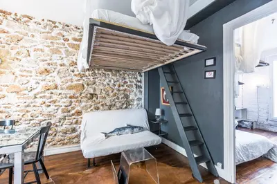 Un ou plusieurs lits dans un hébergement de l'établissement Cosy 40m² near MONTMARTRE