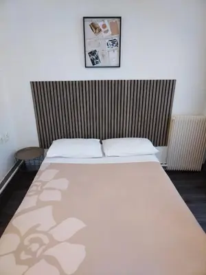 Un ou plusieurs lits dans un hébergement de l'établissement Hôtel de l'Europe