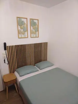 Un ou plusieurs lits dans un hébergement de l'établissement Hôtel de l'Europe