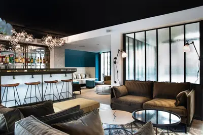 Coin salon dans l'établissement Hôtel Les Deux Girafes