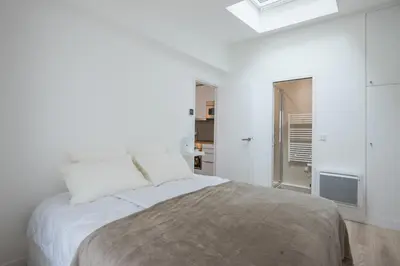 Un ou plusieurs lits dans un hébergement de l'établissement Vintage, F3 avec terrasse, Villa Saint Charles